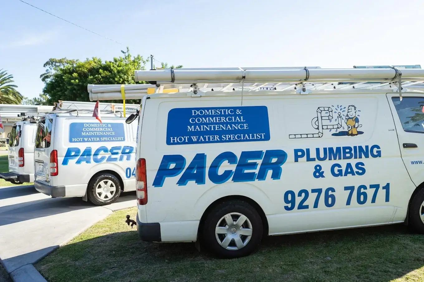 Pacer Plumbing & Gas service vans parked on a Perth street