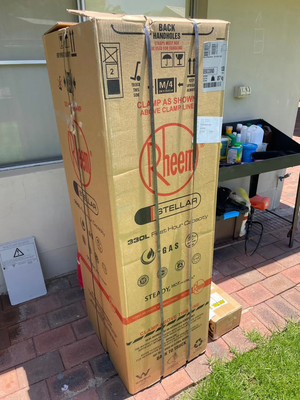 New Rheem Stellar hot water system in its carton on site, ready to install